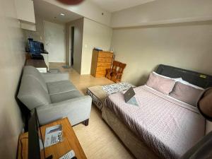 Ένα ή περισσότερα κρεβάτια σε δωμάτιο στο Sunvida Tower Apartment Infront of SM City Cebu