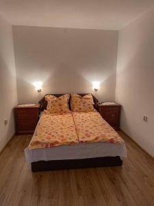 Postel nebo postele na pokoji v ubytování Csomor Apartman + 2 fotografie