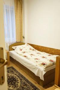 Postel nebo postele na pokoji v ubytování Csomor Apartman