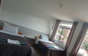 Letto o letti in una camera di HOSTAL La RASA