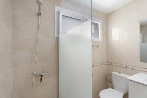 a bathroom with a shower and a toilet at Nido Andrea in San Isidro +16 photos