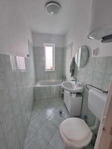 Kúpeľňa v ubytovaní Sárga311 Üdülőház Szeged
