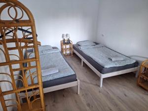 Posteľ alebo postele v izbe v ubytovaní Sárga311 Üdülőház Szeged