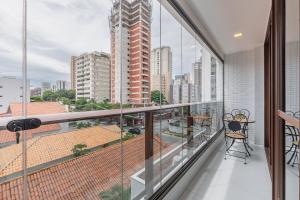 a balcony with a view of a city at JSmart#304 - Apartamento em Fortaleza by Carpediem in Fortaleza