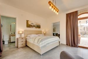 Кровать или кровати в номере Sutorman 1 Villa D&B