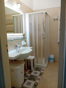 a bathroom with a sink and a shower at Casa Vacanza Villa Lesto in Ischia