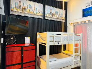 a room with two bunk beds and a tv at Ica Adventures II in Ica