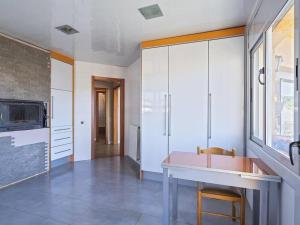 a kitchen with a sink and a large window at Villa Marítima in Pineda de Mar in Pineda de Mar