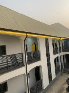 a building with balconies on the side of it at lnfinity Luxury Apartment in Abuja