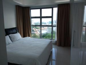 Ένα ή περισσότερα κρεβάτια σε δωμάτιο στο Apartment by WGS Homestay +49 φωτογραφίες