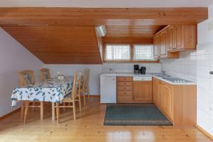 a kitchen with a table and a dining room at Apartmaji Marko in Bled
