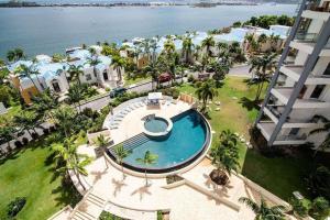 an aerial view of a resort with a swimming pool at Lovely 3-Bed Apartment in Maho in Maho Reef