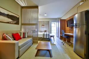 TV a/nebo společenská místnost v ubytování Flat & Lounge SQUARE FARIA LIMA