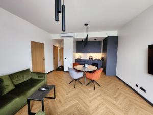 a living room with a couch and a table at PÄRNU CENTER in Pärnu