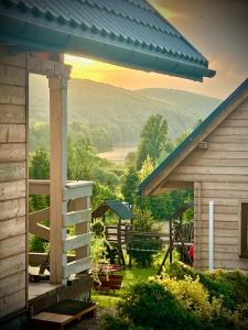 a view of a house with a view of a valley at Domki całoroczne DOMKOWSTWO in Bóbrka