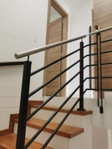 a metal railing on the stairs in a house at Casa en curiti in Curití
