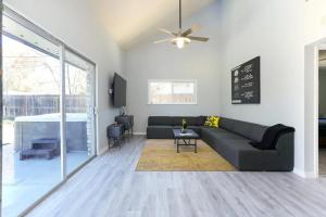 a living room with a couch and a table at Bunker Down - A Birdy Vacation Rental in San Antonio