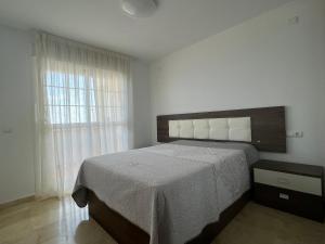 En eller flere senge i et værelse på Torreon del Mar