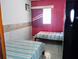 Un pat sau paturi într-o cameră la Residencial 791