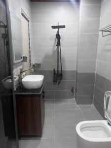 a bathroom with a sink and a toilet at The mountain Sea View in Vung Tau