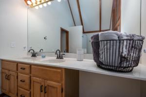 a bathroom with a sink and a mirror at Large home & Close to beach in South Haven +27 photos