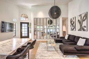a living room with a couch and a table at Old Mill - A Bright Modern Green Valley Bungalow in Las Vegas