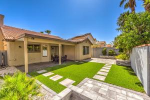 a house with a yard with green grass at Old Mill - A Bright Modern Green Valley Bungalow in Las Vegas