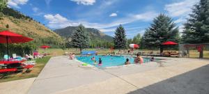 a group of people in a swimming pool at Pickleball Paradise at Star Valley Ranch! in Thayne