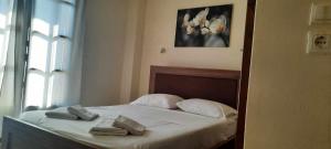 En eller flere senge i et værelse på Villa Bianca