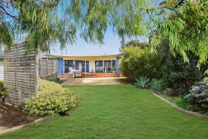 a large house with a yard with a yard at Goolwa Blue Escape - Beach Spacious Wi-fi in Goolwa