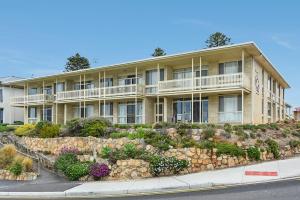 a large apartment building with a retaining wall at 'The Dolphins 7' - Beachfront View To Remember in Port Elliot