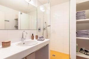 a bathroom with a sink and a shower at Great Stay in Boll in Bad Boll