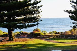 a view of the ocean from a park at Vista Victor Harbor Beachfront Apartment No 4 in Victor Harbor