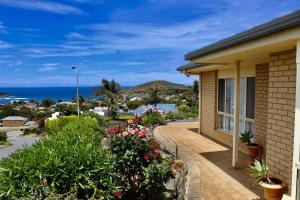 a house with a balcony with a view of the ocean at 'villa Marie' Pet-friendly Sea Views Beach in Encounter Bay