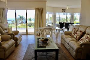 a living room with a couch and a table at "Villa Marie"- Pet-Friendly in Encounter Bay