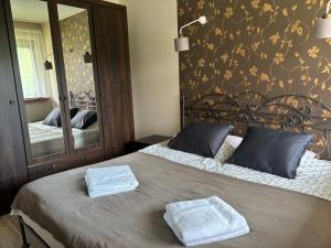 Posteľ alebo postele v izbe v ubytovaní Apartament Widokowy