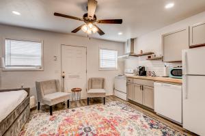 a kitchen with a bed and a ceiling fan at Charming Getaway in Stillwater in Stillwater