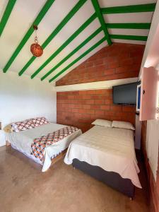 Postel nebo postele na pokoji v ubytování Finca Hotel Isla del Encanto