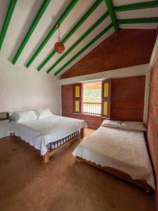 Postel nebo postele na pokoji v ubytování Finca Hotel Isla del Encanto + 26 fotografií