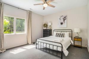 a bedroom with a bed and a ceiling fan at Lily Pond Haven - Private Hot tub - Large recently remodeled home! in Glenn