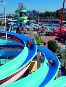 a group of water slides in a water park at Hotel Giorg in Rimini