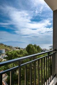 a balcony with a view of the ocean at Davids Apartments in Sarandë