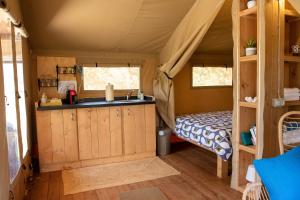 a room with a sink and a bunk bed at Domus Olea Glamping in Ceglie Messapica
