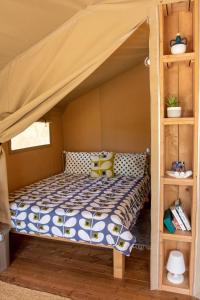 a bed in a room with a bunk bed at Domus Olea Glamping in Ceglie Messapica