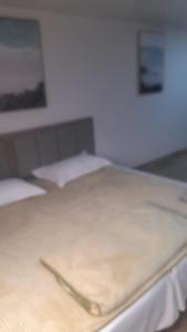 Krevet ili kreveti u jedinici u okviru objekta HOTEL JIMENA