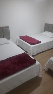 Un pat sau paturi într-o cameră la HOTEL JIMENA