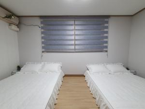 Krevet ili kreveti u jedinici u okviru objekta Hyelang House