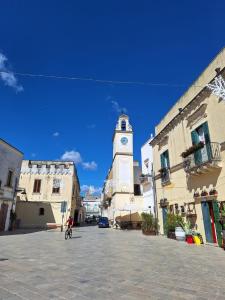 a clock tower in the middle of a street at B&B la Quiete in Leverano