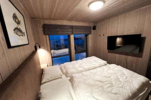 Postelja oz. postelje v sobi nastanitve Fjord-Holiday-Lodge mit atemberaubendem Panorama