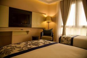 Una cama o camas en una habitación de Dreams hotel